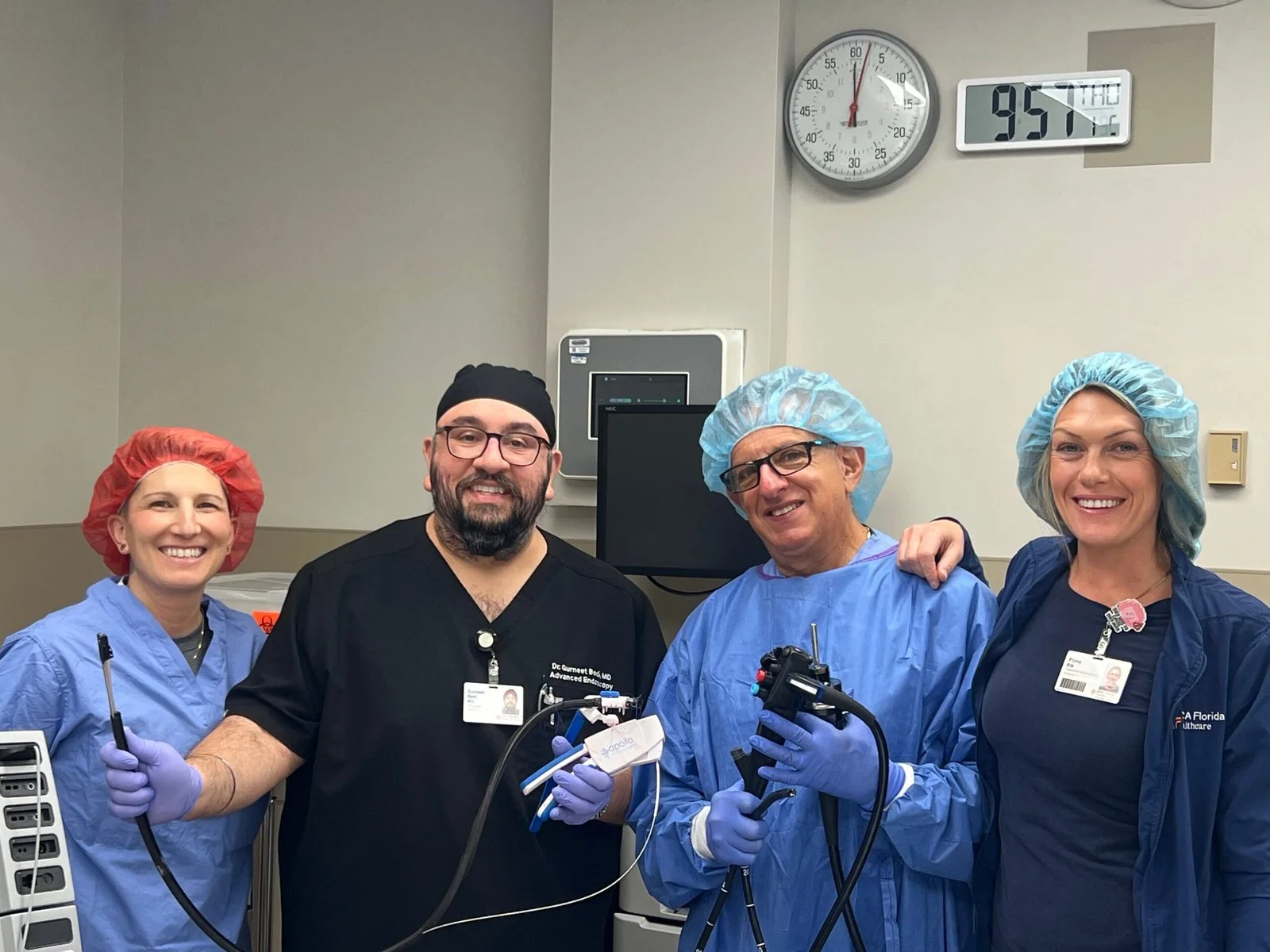 Dr. Bedi with the endoscopy team demonstrating advanced gastrointestinal endoscopy equipment during a clinical procedure.