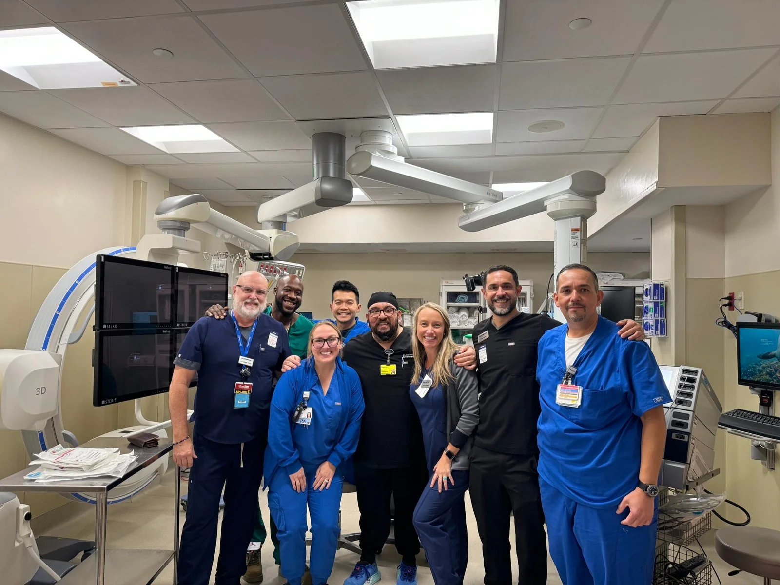Dr. Bedi with the gastroenterology and endoscopy team in a modern hospital procedure suite.